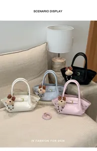 Detailed scene display of fashionable women tote handbags in multiple colors with cute bear charms.