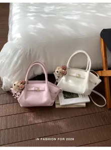 Fashionable women's tote bag with cute bear charm, versatile retro handbag for daily use.