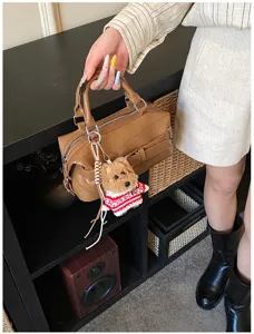 Stylish brown PU leather Boston shoulder bag for women, featuring a cute knit dog keychain.