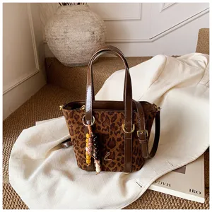 Retro leopard print bucket bag for women, PU suede patchwork handbag with chic top handle.