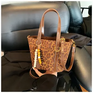 Retro leopard print bucket bag, PU suede patchwork shoulder handbag with cute charm.