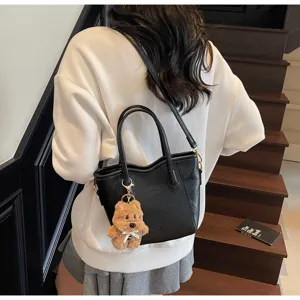 Retro bucket bag for women, stylish autumn winter crossbody shoulder handbag with cute bear charm.