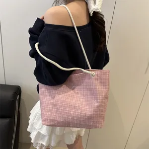 Pink plaid canvas shoulder bag for women, casual tote handbag with rope strap main view.