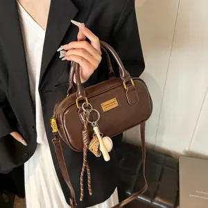 Chic brown Boston shoulder bag for women, versatile PU leather crossbody handbag for daily commuting.