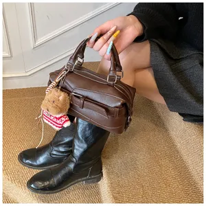 Brown leather bowling handbag, classic boston shoulder bag with cute bear charm for women.