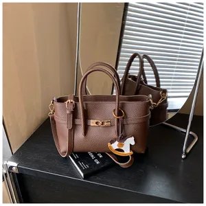 Brown leather tote bag for women, stylish large capacity commuter shoulder handbag.