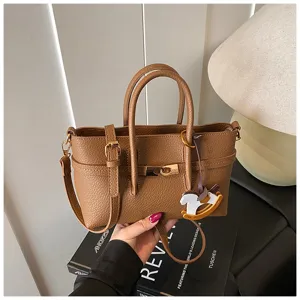 Women pebbled leather top handle shoulder bag daily commuter handbag with lock and charm.