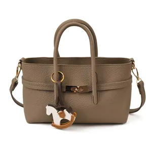Women taupe leather shoulder bag tote top handle crossbody bag with cute horse charm.