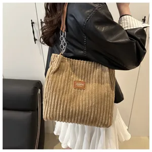 Corduroy chain shoulder tote bag detail view, large capacity casual commuting armpit bag.