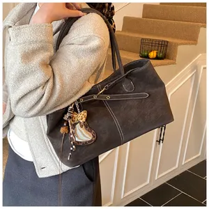 Matte suede tote bag for women, stylish niche design shoulder bag for daily commute.