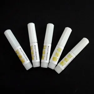 Detail view of professional nail polish remover solvent pens in white tubes for quick removal.