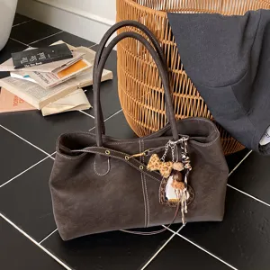Brown suede tote bag for women, stylish large capacity shoulder bag with chic charms.