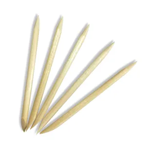 Professional dual-ended wooden nail sticks for cuticle pushing and nail art design tools.