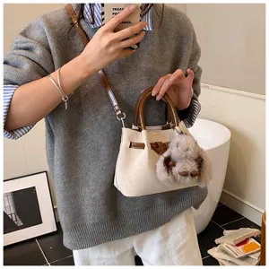 Women handbag stylish bucket bag retro top handle shoulder bag with cute plush bunny charm.