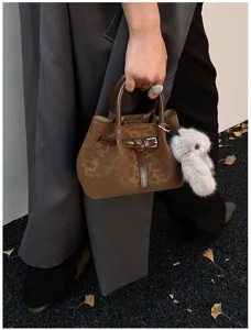 Brown leopard pattern bucket bag with fluffy charm detail, retro style hand-held bag.