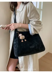 Black matte large capacity tote bag for women, stylish minimalist shoulder commuting bag.
