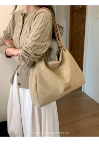Detailed shot of beige slouchy PU leather shoulder tote bag, ideal for daily commute and casual use.