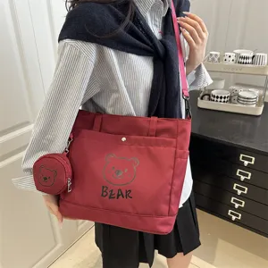 Large capacity canvas tote bag for women, cute bear shoulder bag with small pouch for daily commute.