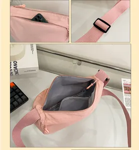 Casual minimalist pink nylon crossbody bag, lightweight daily shoulder bag with zipper pocket.