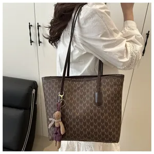 Large capacity commuter tote bag for women, stylish brown monogram shoulder bag with cute rabbit charm.