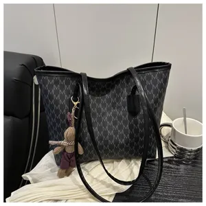 Large capacity casual commuting tote bag with chic monogram pattern and cute bunny charm.