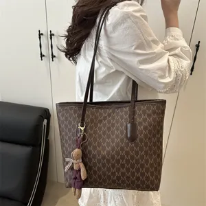 Large capacity stylish tote bag with monogram pattern and cute bunny keychain for women.