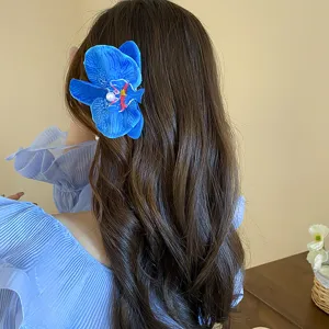 Stunning blue orchid hair claw clip with pearl detail for elegant hairstyles and daily wear.