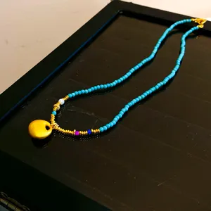 Collier de perles turquoise style chinois avec pendentif sac porte-bonheur doré pour femme