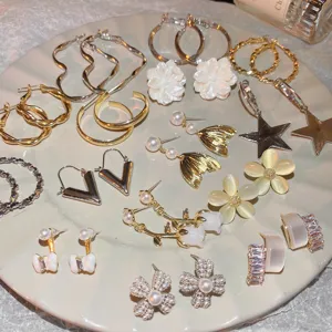 Detail view of stylish women earrings set featuring flower, star, and hoop designs for daily wear.