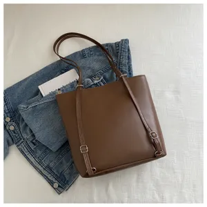 Stylish brown leather tote bag women casual convertible backpack with metal buckle decor