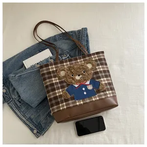 Women brown plaid tote bag with cute teddy bear plush patch, large capacity casual shoulder bag.