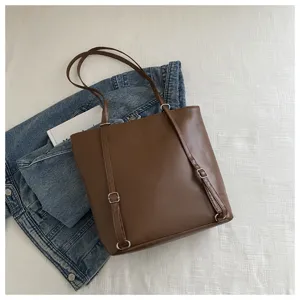 Brown leather tote bag for women, multi-functional shoulder and backpack daily use.