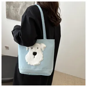 Casual blue tote bag featuring cute white plush dog applique, perfect for daily commuting.