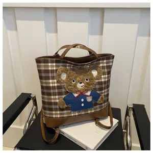 Brown plaid tote bag with cute plush bear patch, large capacity casual shoulder bag for women.