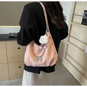 Pink soft shoulder bag with metal butterfly chain and cute cloud pendant for women detail view.