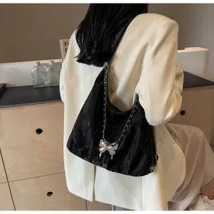 Black soft shoulder bag for women, chic chain strap with butterfly pendant, casual hobo dumpling bag.