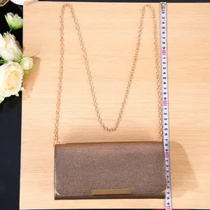 Elegant glittering evening clutch bag with chain strap for women wedding party, sparkling design.