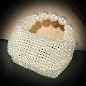 Handcrafted faux pearl beaded handbag detail, elegant chic style for evening parties and resort wear.