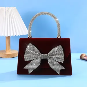 Red velvet evening bag with rhinestone bow and sparkly crystal handle for women dress party.
