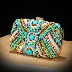 Stunning ethnic beaded evening clutch bag with colorful stones and metal frame for women.