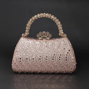 Detailed view of the sparkling crystal evening clutch with rhinestone handle and crown clasp.