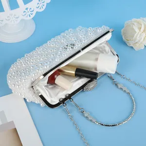 Stunning pearl evening clutch bag with metal chain handle, elegant design for wedding party dresses.
