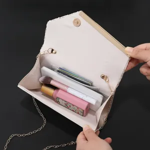 Detailed interior view of the elegant evening clutch bag showing storage and card slots.