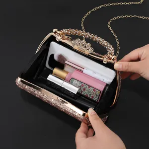 Elegant rhinestone evening clutch bag with chain strap, luxury crystal handbag for party.