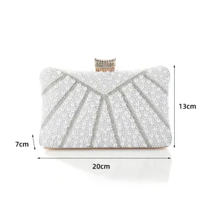 Elegant pearl evening clutch bag with sparkling rhinestones and metal clasp, compact size detail view.