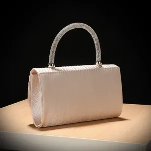 Elegant pleated satin evening clutch with sparkling rhinestone handle for formal events
