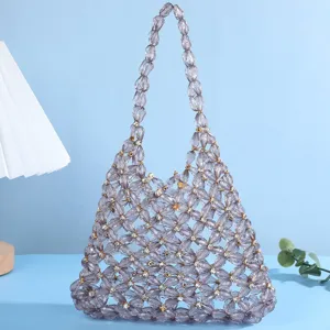 Detail view of the elegant beaded evening bag featuring hollow crystal flower patterns.