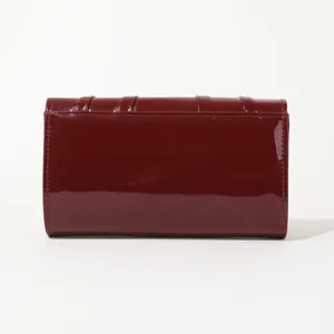Burgundy patent leather clutch detail, stylish vertical pleated design, bridal party bag.