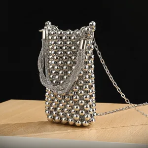 Silver beaded cell phone bag with rhinestone handle and chain strap for evening party chic.