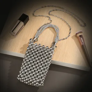 Silver metal beaded phone bag with rhinestone handle and chain strap, perfect for evening parties.